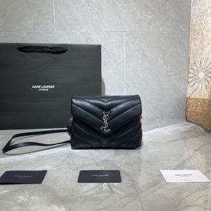 SAINT LAURENT Toy Loulou Matelassé Mini Bag. Authentic quality luxury bag crafted in genuine leather comes with authenticity card, dust bag and gift bag. Embrace Your Inner Rock and Roll Chic. The SAINT LAURENT Toy Loulou Matelassé Mini Bag can be described as a beautifully feminine accessory with a touch of rebellious charm. Its standout feature is the padded quilted leather, which adds volume and texture. The leather chain handles and metal interlocking YSL initials on the front flap give the bag a daring yet timeless allure, making it a luxurious statement piece. The versatility of the YSL LouLou bag is truly impressive, as it can effortlessly transition from casual to formal occasions. The adjustable chain strap allows for the option of wearing it as a crossbody bag, adding to its adaptability. - KRIS + KIKO SAINT LAURENT Toy Loulou Matelassé Mini Bag. Authentic quality luxury bag crafted in genuine leather comes with authenticity card, dust bag and gift bag. Embrace Your Inner Rock and Roll Chic. The SAINT LAURENT Toy Loulou Matelassé Mini Bag can be described as a beautifully feminine accessory with a touch of rebellious charm. Its standout feature is the padded quilted leather, which adds volume and texture. The leather chain handles and metal interlocking YSL initials on the front flap give the bag a daring yet timeless allure, making it a luxurious statement piece. The versatility of the YSL LouLou bag is truly impressive, as it can effortlessly transition from casual to formal occasions. The adjustable chain strap allows for the option of wearing it as a crossbody bag, adding to its adaptability.