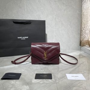 SAINT LAURENT Toy Loulou Matelassé Mini Bag. Authentic quality luxury bag crafted in genuine leather comes with authenticity card, dust bag and gift bag. Embrace Your Inner Rock and Roll Chic. The SAINT LAURENT Toy Loulou Matelassé Mini Bag can be described as a beautifully feminine accessory with a touch of rebellious charm. Its standout feature is the padded quilted leather, which adds volume and texture. The leather chain handles and metal interlocking YSL initials on the front flap give the bag a daring yet timeless allure, making it a luxurious statement piece. The versatility of the YSL LouLou bag is truly impressive, as it can effortlessly transition from casual to formal occasions. The adjustable chain strap allows for the option of wearing it as a crossbody bag, adding to its adaptability. - KRIS + KIKO SAINT LAURENT Toy Loulou Matelassé Mini Bag. Authentic quality luxury bag crafted in genuine leather comes with authenticity card, dust bag and gift bag. Embrace Your Inner Rock and Roll Chic. The SAINT LAURENT Toy Loulou Matelassé Mini Bag can be described as a beautifully feminine accessory with a touch of rebellious charm. Its standout feature is the padded quilted leather, which adds volume and texture. The leather chain handles and metal interlocking YSL initials on the front flap give the bag a daring yet timeless allure, making it a luxurious statement piece. The versatility of the YSL LouLou bag is truly impressive, as it can effortlessly transition from casual to formal occasions. The adjustable chain strap allows for the option of wearing it as a crossbody bag, adding to its adaptability.