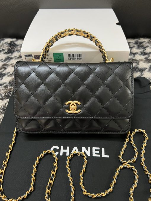 CHANEL Wallet On Chain With Signature Handle. Authentic quality luxury bag crafted in genuine leather comes with authenticity card, dust bag and gift bag. Elevate your style with this wallet  - where timeless design meets practical elegance. Introducing a stunning addition to Chanel's Spring Summer 2022 SLG Collection - a delightful seasonal bag. What sets this bag apart is its uniquely captivating design. Crafted meticulously with diamond quilting using premium calfskin, the center is elegantly embellished with a vintage golden CC logo. Its signature handle gracefully connects to a beautifully woven leather strap. Practicality meets style as this bag showcases a convenient back-pocket and a spacious main compartment with card holders and a chain pocket.