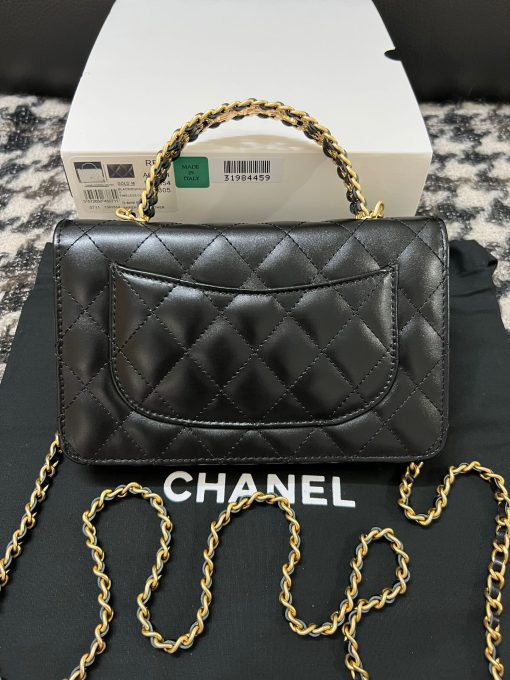 CHANEL Wallet On Chain With Signature Handle. Authentic quality luxury bag crafted in genuine leather comes with authenticity card, dust bag and gift bag. Elevate your style with this wallet  - where timeless design meets practical elegance. Introducing a stunning addition to Chanel's Spring Summer 2022 SLG Collection - a delightful seasonal bag. What sets this bag apart is its uniquely captivating design. Crafted meticulously with diamond quilting using premium calfskin, the center is elegantly embellished with a vintage golden CC logo. Its signature handle gracefully connects to a beautifully woven leather strap. Practicality meets style as this bag showcases a convenient back-pocket and a spacious main compartment with card holders and a chain pocket.