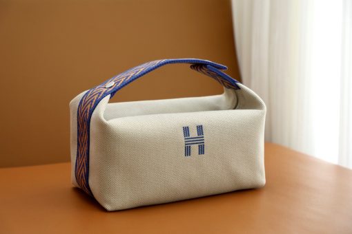 HERMÈS Bride-A-Brace Case. Authentic quality luxury bag crafted in genuine leather comes with authenticity card, dust bag and gift bag. Experience luxury and versatility with this enchanting case- the must-have accessory for high fashion collectors. It might have slipped our attention, but we believe that the HERMÈS Bride-A-Brace Case is an essential item for any serious high fashion collector. This versatile case can be used as a pouch, for beach and holiday excursions, or even as a toiletry bag. The adorable design further adds to its appeal, and it is no surprise that the HERMÈS Bride-A-Brace Case is incredibly popular. Crafted from canvas and featuring an anti-stain water-repellent chevron lining made of cotton, these cases boast a modern 'H' logo embroidery on the front. They come in a single color, allowing for a sleek and sophisticated look. The attention to detail is stunning, with a handle that is beautifully designed from the sides to the top, and a push button closure that seamlessly links it together. Additionally, the elegant shape of the case adds to its overall charm.