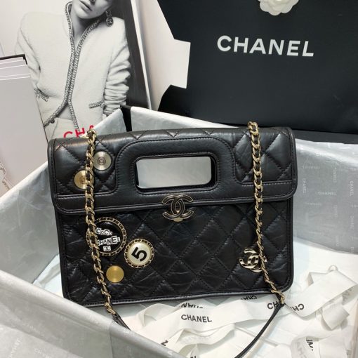 CHANEL Flap Bag with Charms, best high-end quality bag with gift box, dust bag, authenticity card, and CHANEL cloth flower. We love the square-shaped design with a built-in handle for hand carry. Charms give the bag a Punk feel. The center features the CC logo and a woven leather chain strap allows for shoulder carry.