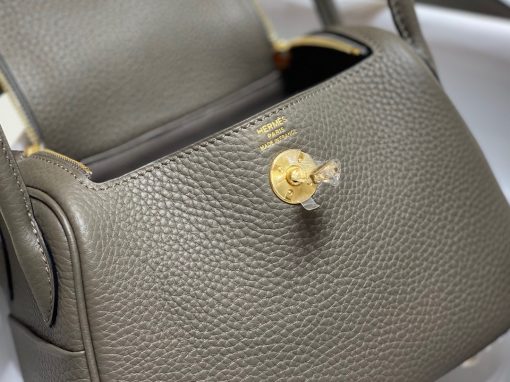 HERMÈS Mini Lindy. Authentic quality luxury bag crafted in genuine leather comes with authenticity card, dust bag and gift bag. Elevating Elegance. Maison HERMÈS is taking the Lindy a notch higher with the exciting addition of the new Mini, thus joining the esteemed holy Trinity of iconic bags - the Birkin, Kelly, and Constance.