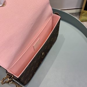 LOUIS VUITTON Pochette Félicie. Authentic quality luxury bag crafted in genuine leather comes with authenticity card, dust bag and gift bag. Elevate your essentials with the Pochette Félicie: Where style meets practicality. The Pochette Félicie in Monogram canvas presents itself as a chic and practical answer to effortlessly carry and arrange your everyday necessities. This adaptable pouch showcases two detachable pockets, including one designed with numerous card slots for your convenience. With the option to elegantly carry it as a clutch or drape it on your shoulder, courtesy of its removable gold-tone chain, versatility becomes its defining feature. - KRIS + KIKO LOUIS VUITTON Pochette Félicie. Original quality bag including gift box, literature, dust bag, authenticity card. The Pochette Félicie in Monogram canvas is a stylish solution to carry and organize daily essentials. This versatile pouch features two removable pockets, including one with several card slots. It can be carried as a clutch or a shoulder bag thanks to a removable gold-tone chain.
