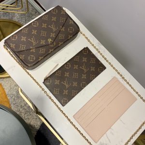 LOUIS VUITTON Pochette Félicie. Authentic quality luxury bag crafted in genuine leather comes with authenticity card, dust bag and gift bag. Elevate your essentials with the Pochette Félicie: Where style meets practicality. The Pochette Félicie in Monogram canvas presents itself as a chic and practical answer to effortlessly carry and arrange your everyday necessities. This adaptable pouch showcases two detachable pockets, including one designed with numerous card slots for your convenience. With the option to elegantly carry it as a clutch or drape it on your shoulder, courtesy of its removable gold-tone chain, versatility becomes its defining feature. - KRIS + KIKO LOUIS VUITTON Pochette Félicie. Authentic quality luxury bag crafted in genuine leather comes with authenticity card, dust bag and gift bag. Elevate your essentials with the Pochette Félicie: Where style meets practicality. The Pochette Félicie in Monogram canvas presents itself as a chic and practical answer to effortlessly carry and arrange your everyday necessities. This adaptable pouch showcases two detachable pockets, including one designed with numerous card slots for your convenience. With the option to elegantly carry it as a clutch or drape it on your shoulder, courtesy of its removable gold-tone chain, versatility becomes its defining feature.