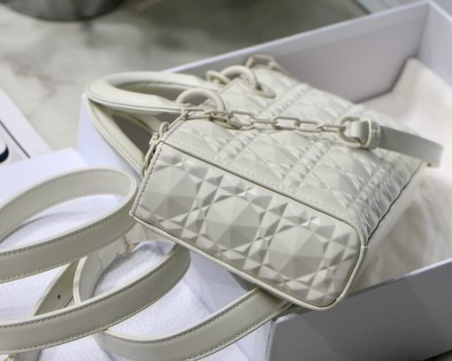 DIOR Lady D-Joy Bag. Authentic quality luxury bag crafted in genuine leather comes with authenticity card, dust bag and gift bag. Embrace timeless elegance - where beauty meets versatility. Exquisitely crafted from Cannage calfskin, this bag perfectly captures the House's unwavering commitment to elegance and beauty. Embodying the iconic streamlined aesthetic of the Lady Dior line, its refined and timeless style is further accentuated by the addition of meticulously designed metal 'D.I.O.R.' charms, gracing its silhouette with elegance. With its versatility in mind, this remarkable bag offers both a removable chain shoulder strap and an adjustable and removable leather shoulder strap, allowing it to be carried by hand or worn crossbody, making it the perfect daily companion.