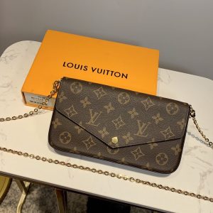 LOUIS VUITTON Pochette Félicie. Authentic quality luxury bag crafted in genuine leather comes with authenticity card, dust bag and gift bag. Elevate your essentials with the Pochette Félicie: Where style meets practicality. The Pochette Félicie in Monogram canvas presents itself as a chic and practical answer to effortlessly carry and arrange your everyday necessities. This adaptable pouch showcases two detachable pockets, including one designed with numerous card slots for your convenience. With the option to elegantly carry it as a clutch or drape it on your shoulder, courtesy of its removable gold-tone chain, versatility becomes its defining feature. - KRIS + KIKO LOUIS VUITTON Pochette Félicie. Authentic quality luxury bag crafted in genuine leather comes with authenticity card, dust bag and gift bag. Elevate your essentials with the Pochette Félicie: Where style meets practicality. The Pochette Félicie in Monogram canvas presents itself as a chic and practical answer to effortlessly carry and arrange your everyday necessities. This adaptable pouch showcases two detachable pockets, including one designed with numerous card slots for your convenience. With the option to elegantly carry it as a clutch or drape it on your shoulder, courtesy of its removable gold-tone chain, versatility becomes its defining feature.