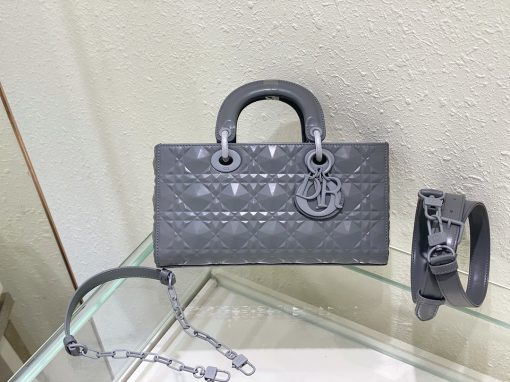 DIOR Lady D-Joy Bag. Authentic quality luxury bag crafted in genuine leather comes with authenticity card, dust bag and gift bag. Embrace timeless elegance - where beauty meets versatility. Exquisitely crafted from Cannage calfskin, this bag perfectly captures the House's unwavering commitment to elegance and beauty. Embodying the iconic streamlined aesthetic of the Lady Dior line, its refined and timeless style is further accentuated by the addition of meticulously designed metal 'D.I.O.R.' charms, gracing its silhouette with elegance. With its versatility in mind, this remarkable bag offers both a removable chain shoulder strap and an adjustable and removable leather shoulder strap, allowing it to be carried by hand or worn crossbody, making it the perfect daily companion.