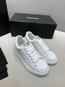 CHANEL Trainers. Authentic quality luxury trainer crafted in genuine leather comes with authenticity card, dust bag and gift bag. Step into Unparalleled Luxury with CHANEL Trainers in Calfskin. Chanel trainers in calfskin are the epitome of luxury and sophistication. Made with high-quality materials, they boast a sleek silhouette and iconic Chanel logo. These trainers offer both comfort and style, making them the perfect choice for any occasion. They embody the essence of Chanel's legacy and are a must-have for fashion connoisseurs seeking timeless elegance. - KRIS + KIKO CHANEL Trainers in calfskin with Sequins. Original Quality Sneakers with gift box, booklet, and authenticity card.