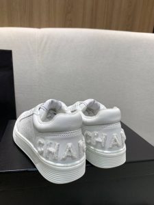 CHANEL Trainers. Authentic quality luxury trainer crafted in genuine leather comes with authenticity card, dust bag and gift bag. Step into Unparalleled Luxury with CHANEL Trainers in Calfskin. Chanel trainers in calfskin are the epitome of luxury and sophistication. Made with high-quality materials, they boast a sleek silhouette and iconic Chanel logo. These trainers offer both comfort and style, making them the perfect choice for any occasion. They embody the essence of Chanel's legacy and are a must-have for fashion connoisseurs seeking timeless elegance. - KRIS + KIKO CHANEL Trainers in calfskin with Sequins. Original Quality Sneakers with gift box, booklet, and authenticity card.