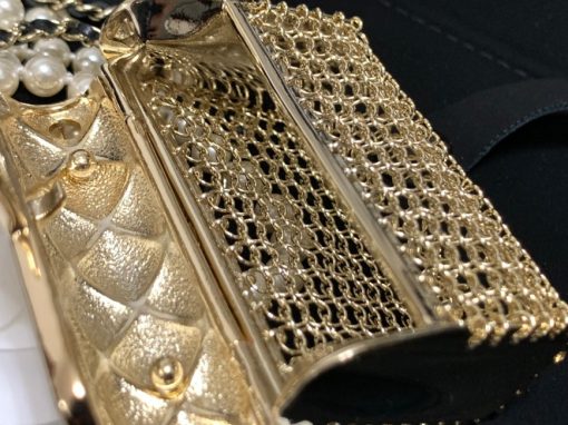 CHANEL Long Necklace. Authentic quality luxury bag crafted in genuine leather comes with authenticity card, dust bag and gift bag. Adorn yourself with timeless elegance. Introducing the exquisite CHANEL Long Necklace in a captivating combination of Gold, Black, and Pearly White, which proudly belongs to the esteemed Spring-Summer 2021 fashion collection. Meticulously designed and masterfully crafted, this stunning piece showcases the exceptional artistry and dedication synonymous with the iconic House of CHANEL.