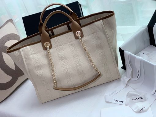 CHANEL Large Deauville Shopping Bag 2021. Authentic quality luxury bag crafted in genuine leather comes with authenticity card, dust bag and gift bag. Classic Elegance Meets Enduring Style. The CHANEL Deauville tote has evolved into an iconic CHANEL bag, gaining recognition as a popular choice. It frequently makes appearances in seasonal collections, showcasing surprising hues and materials. Interestingly, on the CHANEL website, it is referred to as the Shopping Bag; however, if you visit a CHANEL boutique and inquire about the Deauville, you will be guided to this exquisite tote bag.