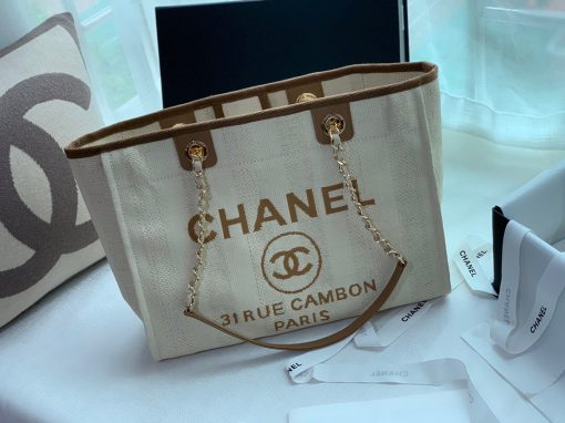 CHANEL Large Deauville Shopping Bag 2021. Authentic quality luxury bag crafted in genuine leather comes with authenticity card, dust bag and gift bag. Classic Elegance Meets Enduring Style. The CHANEL Deauville tote has evolved into an iconic CHANEL bag, gaining recognition as a popular choice. It frequently makes appearances in seasonal collections, showcasing surprising hues and materials. Interestingly, on the CHANEL website, it is referred to as the Shopping Bag; however, if you visit a CHANEL boutique and inquire about the Deauville, you will be guided to this exquisite tote bag.