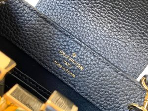 LOUIS VUITTON Capucines Mini. Authentic quality luxury bag crafted in genuine leather comes with authenticity card, dust bag and gift bag. Captivatingly vibrant. Effortlessly sophisticated. Crafted from vibrant Taurillon leather, the Capucines Mini handbag exudes an exquisite charm. Its striking color palette is tastefully enhanced by the understated metal handle rings. Just like every Capucines, this Mini version can be effortlessly carried with the flap out, adding an air of effortless elegance, or tucked inside to showcase the iconic LV Initials. - KRIS + KIKO LOUIS VUITTON Capucines Mini. Original Quality Bag including gift box, literature, dust bag, authenticity card. Fashioned from vibrantly colored Taurillon leather, the Capucines Mini handbag pops. The fresh new colorway is perfectly complemented by the discreet metal handle rings. Like all Capucines, the Mini can be carried with the flap out for simple sophistication or tucked inside to feature the LV Initials.