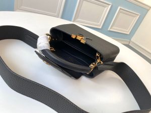 LOUIS VUITTON Capucines Mini. Authentic quality luxury bag crafted in genuine leather comes with authenticity card, dust bag and gift bag. Captivatingly vibrant. Effortlessly sophisticated. Crafted from vibrant Taurillon leather, the Capucines Mini handbag exudes an exquisite charm. Its striking color palette is tastefully enhanced by the understated metal handle rings. Just like every Capucines, this Mini version can be effortlessly carried with the flap out, adding an air of effortless elegance, or tucked inside to showcase the iconic LV Initials. - KRIS + KIKO LOUIS VUITTON Capucines Mini. Authentic quality luxury bag crafted in genuine leather comes with authenticity card, dust bag and gift bag. Captivatingly vibrant. Effortlessly sophisticated. Crafted from vibrant Taurillon leather, the Capucines Mini handbag exudes an exquisite charm. Its striking color palette is tastefully enhanced by the understated metal handle rings. Just like every Capucines, this Mini version can be effortlessly carried with the flap out, adding an air of effortless elegance, or tucked inside to showcase the iconic LV Initials.