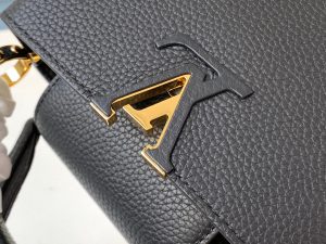 LOUIS VUITTON Capucines Mini. Authentic quality luxury bag crafted in genuine leather comes with authenticity card, dust bag and gift bag. Captivatingly vibrant. Effortlessly sophisticated. Crafted from vibrant Taurillon leather, the Capucines Mini handbag exudes an exquisite charm. Its striking color palette is tastefully enhanced by the understated metal handle rings. Just like every Capucines, this Mini version can be effortlessly carried with the flap out, adding an air of effortless elegance, or tucked inside to showcase the iconic LV Initials. - KRIS + KIKO LOUIS VUITTON Capucines Mini. Authentic quality luxury bag crafted in genuine leather comes with authenticity card, dust bag and gift bag. Captivatingly vibrant. Effortlessly sophisticated. Crafted from vibrant Taurillon leather, the Capucines Mini handbag exudes an exquisite charm. Its striking color palette is tastefully enhanced by the understated metal handle rings. Just like every Capucines, this Mini version can be effortlessly carried with the flap out, adding an air of effortless elegance, or tucked inside to showcase the iconic LV Initials.