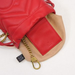 GUCCI GG Marmont Mini Bucket Bag. Authentic quality luxury bag crafted in genuine leather comes with authenticity card, dust bag and gift bag. Unleash the Vibrant Charm of Timeless Elegance. Introducing the latest addition to the GG Marmont collection: the mini bucket bag in stunning vibrant tones, meticulously crafted from Matelassé leather. This exquisite piece draws inspiration from a timeless '70s design, symbolizing the essence of the House. The iconic Double G emblem adorns the front of this accessory, further elevating its allure. With its convenient chain strap and elegant drawstring closure, this versatile bag effortlessly transitions from a shoulder bag to a crossbody one. Experience the epitome of style and functionality with this remarkable creation. - KRIS + KIKO GUCCI GG Marmont Mini Bucket Bag. Authentic quality luxury bag crafted in genuine leather comes with authenticity card, dust bag and gift bag. Unleash the Vibrant Charm of Timeless Elegance. Introducing the latest addition to the GG Marmont collection: the mini bucket bag in stunning vibrant tones, meticulously crafted from Matelassé leather. This exquisite piece draws inspiration from a timeless '70s design, symbolizing the essence of the House. The iconic Double G emblem adorns the front of this accessory, further elevating its allure. With its convenient chain strap and elegant drawstring closure, this versatile bag effortlessly transitions from a shoulder bag to a crossbody one. Experience the epitome of style and functionality with this remarkable creation.