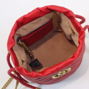 GUCCI GG Marmont Mini Bucket Bag. Authentic quality luxury bag crafted in genuine leather comes with authenticity card, dust bag and gift bag. Unleash the Vibrant Charm of Timeless Elegance. Introducing the latest addition to the GG Marmont collection: the mini bucket bag in stunning vibrant tones, meticulously crafted from Matelassé leather. This exquisite piece draws inspiration from a timeless '70s design, symbolizing the essence of the House. The iconic Double G emblem adorns the front of this accessory, further elevating its allure. With its convenient chain strap and elegant drawstring closure, this versatile bag effortlessly transitions from a shoulder bag to a crossbody one. Experience the epitome of style and functionality with this remarkable creation. - KRIS + KIKO GUCCI GG Marmont Mini Bucket Bag. Original Quality Bag including gift box, literature, dust bag, authenticity card. The world of GG Marmont expands with the introduction of a mini bucket bag shape crafted from Matelassé leather in vibrant tones. Inspired by an archival design from the '70s, a hallmark era of the House, the Double G decorates the front of this accessory. Featuring a chain strap and drawstring closure the versatile shape can be worn as shoulder and as a crossbody bag.