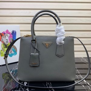 PRADA Galleria Saffiano Leather Bag. Authentic quality luxury bag crafted in genuine leather comes with authenticity card, dust bag and gift bag. An Icon of Timeless Elegance. The Prada Galleria bag embodies a timeless elegance that is truly unmatched. It takes its name from the iconic Prada store, which was first established by Mario Prada back in 1913 within the prestigious Galleria Vittorio Emanuele II of Milan. This exceptional design seamlessly blends tradition and modernity, captivating with its minimalist yet refined aesthetic. - KRIS + KIKO PRADA Galleria Saffiano Leather Bag. Authentic quality luxury bag crafted in genuine leather comes with authenticity card, dust bag and gift bag. An Icon of Timeless Elegance. The Prada Galleria bag embodies a timeless elegance that is truly unmatched. It takes its name from the iconic Prada store, which was first established by Mario Prada back in 1913 within the prestigious Galleria Vittorio Emanuele II of Milan. This exceptional design seamlessly blends tradition and modernity, captivating with its minimalist yet refined aesthetic.