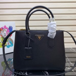 PRADA Galleria Saffiano Leather Bag. Authentic quality luxury bag crafted in genuine leather comes with authenticity card, dust bag and gift bag. An Icon of Timeless Elegance. The Prada Galleria bag embodies a timeless elegance that is truly unmatched. It takes its name from the iconic Prada store, which was first established by Mario Prada back in 1913 within the prestigious Galleria Vittorio Emanuele II of Milan. This exceptional design seamlessly blends tradition and modernity, captivating with its minimalist yet refined aesthetic. - KRIS + KIKO PRADA Galleria Saffiano Leather Bag. Original Quality Bag including gift box, literature, dust bag, authenticity card. The Prada Galleria bag, the quintessence of timeless elegance, is named after the historic Prada store that Mario Prada opened in 1913 in the Galleria Vittorio Emanuele II of Milan. Tradition and modernity meet in the design that is both minimalist and refined.