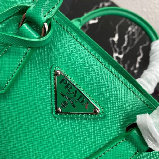 PRADA Galleria Micro Bag. Authentic quality luxury bag crafted in genuine leather comes with authenticity card, dust bag and gift bag. Timeless Elegance Evolved. Prada is renowned for its commitment to reinvention and pushing the boundaries of fashion. Exemplifying timeless sophistication, the Pr*da Galleria bag is crafted from the iconic Saffiano leather, a material distinguished by its crosshatch texture and impeccably waxed finish. Boasting distinctive hardware, a familiar yet refined silhouette, and an understated elegance, this bag is exceptionally suitable for professional settings. Moreover, its practicality is unparalleled, featuring a convenient shoulder strap. Paying homage to the prestigious history of Prada, the bag derives its name from the Galleria Vittorio Emanuele II store, which Mario Prada established in Milan in 1913.