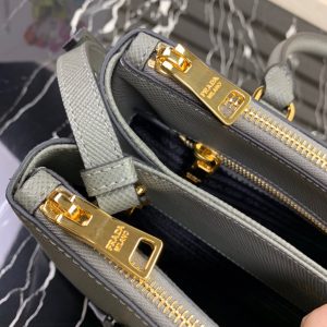 PRADA Galleria Saffiano Leather Bag. Authentic quality luxury bag crafted in genuine leather comes with authenticity card, dust bag and gift bag. An Icon of Timeless Elegance. The Prada Galleria bag embodies a timeless elegance that is truly unmatched. It takes its name from the iconic Prada store, which was first established by Mario Prada back in 1913 within the prestigious Galleria Vittorio Emanuele II of Milan. This exceptional design seamlessly blends tradition and modernity, captivating with its minimalist yet refined aesthetic. - KRIS + KIKO PRADA Galleria Saffiano Leather Bag. Original Quality Bag including gift box, literature, dust bag, authenticity card. The Prada Galleria bag, the quintessence of timeless elegance, is named after the historic Prada store that Mario Prada opened in 1913 in the Galleria Vittorio Emanuele II of Milan. Tradition and modernity meet in the design that is both minimalist and refined.