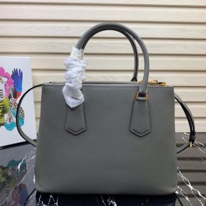 PRADA Galleria Saffiano Leather Bag. Authentic quality luxury bag crafted in genuine leather comes with authenticity card, dust bag and gift bag. An Icon of Timeless Elegance. The Prada Galleria bag embodies a timeless elegance that is truly unmatched. It takes its name from the iconic Prada store, which was first established by Mario Prada back in 1913 within the prestigious Galleria Vittorio Emanuele II of Milan. This exceptional design seamlessly blends tradition and modernity, captivating with its minimalist yet refined aesthetic. - KRIS + KIKO PRADA Galleria Saffiano Leather Bag. Authentic quality luxury bag crafted in genuine leather comes with authenticity card, dust bag and gift bag. An Icon of Timeless Elegance. The Prada Galleria bag embodies a timeless elegance that is truly unmatched. It takes its name from the iconic Prada store, which was first established by Mario Prada back in 1913 within the prestigious Galleria Vittorio Emanuele II of Milan. This exceptional design seamlessly blends tradition and modernity, captivating with its minimalist yet refined aesthetic.