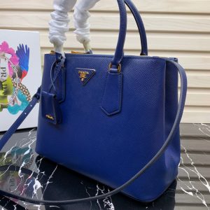 PRADA Galleria Saffiano Leather Bag. Authentic quality luxury bag crafted in genuine leather comes with authenticity card, dust bag and gift bag. An Icon of Timeless Elegance. The Prada Galleria bag embodies a timeless elegance that is truly unmatched. It takes its name from the iconic Prada store, which was first established by Mario Prada back in 1913 within the prestigious Galleria Vittorio Emanuele II of Milan. This exceptional design seamlessly blends tradition and modernity, captivating with its minimalist yet refined aesthetic. - KRIS + KIKO PRADA Galleria Saffiano Leather Bag. Original Quality Bag including gift box, literature, dust bag, authenticity card. The Prada Galleria bag, the quintessence of timeless elegance, is named after the historic Prada store that Mario Prada opened in 1913 in the Galleria Vittorio Emanuele II of Milan. Tradition and modernity meet in the design that is both minimalist and refined.