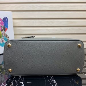 PRADA Galleria Saffiano Leather Bag. Authentic quality luxury bag crafted in genuine leather comes with authenticity card, dust bag and gift bag. An Icon of Timeless Elegance. The Prada Galleria bag embodies a timeless elegance that is truly unmatched. It takes its name from the iconic Prada store, which was first established by Mario Prada back in 1913 within the prestigious Galleria Vittorio Emanuele II of Milan. This exceptional design seamlessly blends tradition and modernity, captivating with its minimalist yet refined aesthetic.