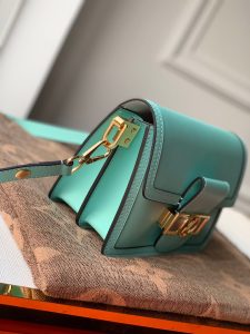 LOUIS VUITTON Mini Dauphine Crossbody and Shoulder Bag. Authentic quality luxury bag crafted in genuine leather comes with authenticity card, dust bag and gift bag. Elevate your style with the Lugano Mini - a timeless masterpiece. The newest addition to its beloved Dauphine family - the Lugano Mini. Crafted from sleek calfskin leather, it showcases an exquisite gold LV circle lock adorned with intricate silver guilloche detailing. Boasting refined and elegant design, along with practical carrying options, this bag is an absolute essential for fervent fans of the Dauphine collection. - KRIS + KIKO LOUIS VUITTON Mini Dauphine Crossbody and Shoulder Bag. Original Quality Bag including gift box, literature, dust bag, authenticity card. LOUIS VUITTON is expanding its Dauphine family with the Lugano Mini. In smooth calfskin leather, it features striking new signature touches like a gold LV circle lock trimmed with silver guilloche. Refined, elegant styling and convenient carry options make this bag a must-have for Dauphine lovers.