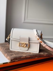 LOUIS VUITTON Mini Dauphine Crossbody and Shoulder Bag. Authentic quality luxury bag crafted in genuine leather comes with authenticity card, dust bag and gift bag. Elevate your style with the Lugano Mini - a timeless masterpiece. The newest addition to its beloved Dauphine family - the Lugano Mini. Crafted from sleek calfskin leather, it showcases an exquisite gold LV circle lock adorned with intricate silver guilloche detailing. Boasting refined and elegant design, along with practical carrying options, this bag is an absolute essential for fervent fans of the Dauphine collection. - KRIS + KIKO LOUIS VUITTON Mini Dauphine Crossbody and Shoulder Bag. Original Quality Bag including gift box, literature, dust bag, authenticity card. LOUIS VUITTON is expanding its Dauphine family with the Lugano Mini. In smooth calfskin leather, it features striking new signature touches like a gold LV circle lock trimmed with silver guilloche. Refined, elegant styling and convenient carry options make this bag a must-have for Dauphine lovers.
