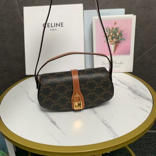 CELINE Clutch On Strap. Authentic quality luxury bag crafted in genuine leather comes with authenticity card, dust bag and gift bag. Impeccably Minimalistic, Captivatingly Chic. Celine has truly outdone themselves with this exquisite small bag, which showcases their exceptional design skills in a minimalistic edition. The standout feature of this bag is the remarkable leather strap that elegantly connects to the ornamental lock, boasting a beautifully large and shimmering gold hardware. This captivating lock will undoubtedly steal all the attention. To cater to various carrying preferences, the bag is equipped with a convenient short-handle for hand-carry, while also providing a long leather strap for shoulder carry. The slender and delicate appearance of the straps adds a touch of femininity to this delightful creation.