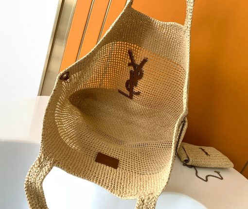 SAINT LAURENT ICare In Raffia. Authentic quality luxury bag comes with authenticity card, dust bag and gift bag. Handcrafted elegance with versatile style. Introducing the Maxi Shopping Bag, exquisitely crafted from hand-embroidered natural raffia. This exceptional piece showcases the finest savoir-faire and specialized craftsmanship. Adorned with an oversized, sculptural Cassandre, the bag features an inner chain that can be used to adjust the sides for versatile styling. Additionally, it comes with a removable raffia sunglasses case, elegantly attached by a long chain, blending functionality with high fashion.