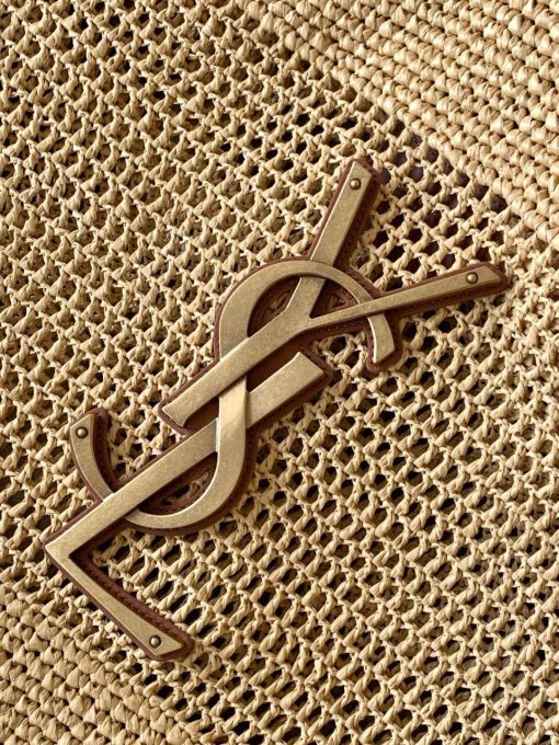 SAINT LAURENT ICare In Raffia. Authentic quality luxury bag comes with authenticity card, dust bag and gift bag. Handcrafted elegance with versatile style. Introducing the Maxi Shopping Bag, exquisitely crafted from hand-embroidered natural raffia. This exceptional piece showcases the finest savoir-faire and specialized craftsmanship. Adorned with an oversized, sculptural Cassandre, the bag features an inner chain that can be used to adjust the sides for versatile styling. Additionally, it comes with a removable raffia sunglasses case, elegantly attached by a long chain, blending functionality with high fashion.