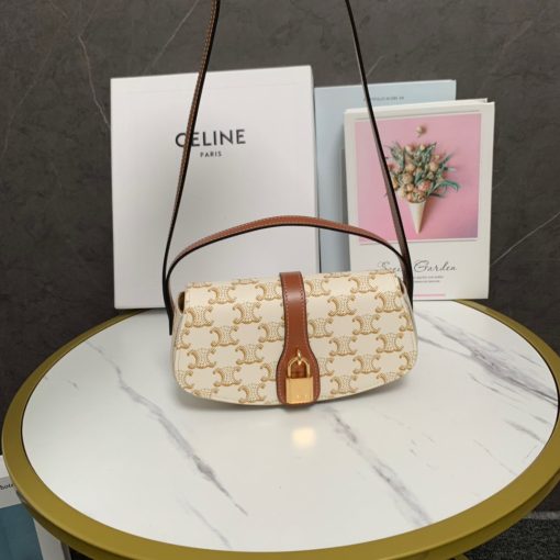CELINE Clutch On Strap. Authentic quality luxury bag crafted in genuine leather comes with authenticity card, dust bag and gift bag. Impeccably Minimalistic, Captivatingly Chic. Celine has truly outdone themselves with this exquisite small bag, which showcases their exceptional design skills in a minimalistic edition. The standout feature of this bag is the remarkable leather strap that elegantly connects to the ornamental lock, boasting a beautifully large and shimmering gold hardware. This captivating lock will undoubtedly steal all the attention. To cater to various carrying preferences, the bag is equipped with a convenient short-handle for hand-carry, while also providing a long leather strap for shoulder carry. The slender and delicate appearance of the straps adds a touch of femininity to this delightful creation.