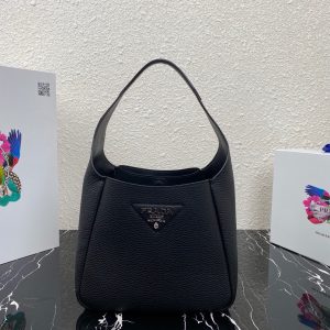 PRADA Logo Plaque Tote Bag. Authentic quality luxury bag crafted in genuine leather comes with authenticity card, dust bag and gift bag. A Masterpiece of Organization, Elegance, and Versatility. Introducing the generously sized shopper tote by PRADA, featuring three internal compartments for impeccable organization. With its timeless and adaptable design, Prada has perfected the ultimate bag that fulfills all your needs. Crafted from luxurious leather, this tote bag showcases an elegant logo patch, complemented by a sleek silver-tone logo plaque at the front. Inside, you'll find an internal signature triangle logo patch, adding an extra touch of sophistication. This exquisite tote is the ideal addition to your expanding collection. - KRIS + KIKO PRADA Logo Plaque Tote Bag. Original Quality Bag including gift box, literature, dust bag, authenticity card. This spacious shopper tote from PRADA boasts three internal compartments to ensure organization. Classic in design and as versatile as it gets, Prada knows how to design the bag that tote-ally fits all your needs and it comes in the form of this leather logo patch tote bag. This tote bag is detailed with a silver-tone logo plaque to the front and an internal signature triangle logo patch which give it an extra refined touch. The perfect addition to your ever-growing collection.