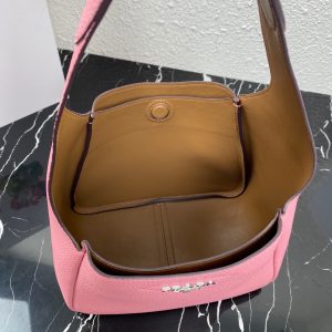 PRADA Logo Plaque Tote Bag. Authentic quality luxury bag crafted in genuine leather comes with authenticity card, dust bag and gift bag. A Masterpiece of Organization, Elegance, and Versatility. Introducing the generously sized shopper tote by PRADA, featuring three internal compartments for impeccable organization. With its timeless and adaptable design, Prada has perfected the ultimate bag that fulfills all your needs. Crafted from luxurious leather, this tote bag showcases an elegant logo patch, complemented by a sleek silver-tone logo plaque at the front. Inside, you'll find an internal signature triangle logo patch, adding an extra touch of sophistication. This exquisite tote is the ideal addition to your expanding collection. - KRIS + KIKO PRADA Logo Plaque Tote Bag. Original Quality Bag including gift box, literature, dust bag, authenticity card. This spacious shopper tote from PRADA boasts three internal compartments to ensure organization. Classic in design and as versatile as it gets, Prada knows how to design the bag that tote-ally fits all your needs and it comes in the form of this leather logo patch tote bag. This tote bag is detailed with a silver-tone logo plaque to the front and an internal signature triangle logo patch which give it an extra refined touch. The perfect addition to your ever-growing collection.