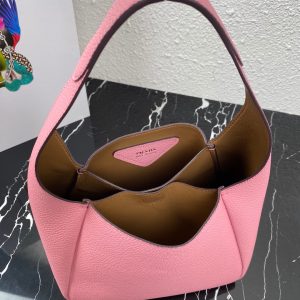 PRADA Logo Plaque Tote Bag. Authentic quality luxury bag crafted in genuine leather comes with authenticity card, dust bag and gift bag. A Masterpiece of Organization, Elegance, and Versatility. Introducing the generously sized shopper tote by PRADA, featuring three internal compartments for impeccable organization. With its timeless and adaptable design, Prada has perfected the ultimate bag that fulfills all your needs. Crafted from luxurious leather, this tote bag showcases an elegant logo patch, complemented by a sleek silver-tone logo plaque at the front. Inside, you'll find an internal signature triangle logo patch, adding an extra touch of sophistication. This exquisite tote is the ideal addition to your expanding collection. - KRIS + KIKO PRADA Logo Plaque Tote Bag. Original Quality Bag including gift box, literature, dust bag, authenticity card. This spacious shopper tote from PRADA boasts three internal compartments to ensure organization. Classic in design and as versatile as it gets, Prada knows how to design the bag that tote-ally fits all your needs and it comes in the form of this leather logo patch tote bag. This tote bag is detailed with a silver-tone logo plaque to the front and an internal signature triangle logo patch which give it an extra refined touch. The perfect addition to your ever-growing collection.