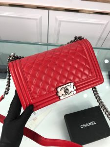 CHANEL Boy Quilted Leather Flap Bag. Authentic quality luxury bag crafted in genuine leather comes with authenticity card, dust bag and gift bag. Unveil Elegance: Elevate Your Style with CHANEL's Iconic Quilted Flap Bag. Elegantly designed, this exceptional CHANEL Boy quilted flap bag boasts a striking chain-link strap with a comfortable shoulder pad, a distinctive CC Boy logo push-lock closure, and exquisite antiqued hardware accents. Opening the push-lock closure reveals a luxurious black fabric-lined interior, complete with convenient side zip and slip pockets, perfect for securely organizing one's daily necessities. - KRIS + KIKO CHANEL Boy Quilted Leather Flap Bag. Original Quality Bag including gift box, literature, dust bag, authenticity card. This stand-out, enviable CHANEL Boy quilted flap bag features a chunky chain-link strap with shoulder pad, CC Boy logo push-lock closure, and antiqued hardware accents. Its push-lock closure opens to a black fabric-lined interior with side zip and slip pockets to secure daily essentials.