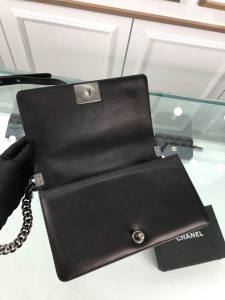 CHANEL Boy Quilted Leather Flap Bag. Authentic quality luxury bag crafted in genuine leather comes with authenticity card, dust bag and gift bag. Unveil Elegance: Elevate Your Style with CHANEL's Iconic Quilted Flap Bag. Elegantly designed, this exceptional CHANEL Boy quilted flap bag boasts a striking chain-link strap with a comfortable shoulder pad, a distinctive CC Boy logo push-lock closure, and exquisite antiqued hardware accents. Opening the push-lock closure reveals a luxurious black fabric-lined interior, complete with convenient side zip and slip pockets, perfect for securely organizing one's daily necessities. - KRIS + KIKO CHANEL Boy Quilted Leather Flap Bag. Authentic quality luxury bag crafted in genuine leather comes with authenticity card, dust bag and gift bag. Unveil Elegance: Elevate Your Style with CHANEL's Iconic Quilted Flap Bag. Elegantly designed, this exceptional CHANEL Boy quilted flap bag boasts a striking chain-link strap with a comfortable shoulder pad, a distinctive CC Boy logo push-lock closure, and exquisite antiqued hardware accents. Opening the push-lock closure reveals a luxurious black fabric-lined interior, complete with convenient side zip and slip pockets, perfect for securely organizing one's daily necessities.