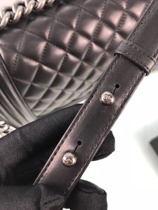 CHANEL Boy Quilted Leather Flap Bag. Authentic quality luxury bag crafted in genuine leather comes with authenticity card, dust bag and gift bag. Unveil Elegance: Elevate Your Style with CHANEL's Iconic Quilted Flap Bag. Elegantly designed, this exceptional CHANEL Boy quilted flap bag boasts a striking chain-link strap with a comfortable shoulder pad, a distinctive CC Boy logo push-lock closure, and exquisite antiqued hardware accents. Opening the push-lock closure reveals a luxurious black fabric-lined interior, complete with convenient side zip and slip pockets, perfect for securely organizing one's daily necessities. - KRIS + KIKO CHANEL Boy Quilted Leather Flap Bag. Authentic quality luxury bag crafted in genuine leather comes with authenticity card, dust bag and gift bag. Unveil Elegance: Elevate Your Style with CHANEL's Iconic Quilted Flap Bag. Elegantly designed, this exceptional CHANEL Boy quilted flap bag boasts a striking chain-link strap with a comfortable shoulder pad, a distinctive CC Boy logo push-lock closure, and exquisite antiqued hardware accents. Opening the push-lock closure reveals a luxurious black fabric-lined interior, complete with convenient side zip and slip pockets, perfect for securely organizing one's daily necessities.