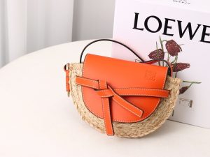 LOEWE Gate Mini Raffia Crossbody Bag. Authentic quality luxury bag crafted in genuine leather comes with authenticity card, dust bag and gift bag. A forever-loved accessory for the style-conscious. Complete your outfit with this delightful woven raffia version of Loewe's popular Gate bag, perfect for the summer season. The petite design showcases a charming flap closure made from calf leather, adorned with a graceful knot detail that wraps over the front. Consider it a timeless investment that you'll cherish for years to come. - KRIS + KIKO LOEWE Gate Mini Raffia Crossbody Bag. Original Quality Bag. Authentic Soft Calfskin and Woven Raffia. LOEWE Sales Box and Dust Bag. Booklet, Authenticity Card, Payment Slip. Finish off your look with this summery woven raffia iteration of Loewe's beloved Gate bag. The mini silhouette features a contrasting flap closure, which has been made from calf leather with an elegant knot detail wrapping over the front. Think of it as the sort of piece that you'll buy now but love forever.