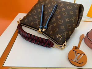 LOUIS VUITTON Beaubourg Hobo Mini Handbag. Authentic quality luxury bag crafted in genuine leather comes with authenticity card, dust bag and gift bag. Braided Elegance, Playfully Refined. Introducing the irresistibly charming Beaubourg Hobo Mini handbag, crafted with utmost care in Monogram canvas. Its elegant braided top handle showcases the House's exemplary leather craftsmanship, accentuated by expertly hand-painted edge dyeing. Adding a touch of sophistication, the oversized LV charm exudes class. Meanwhile, the vibrant name tag and shoulder strap inject a playful aura. This handbag is a perfect companion for daytime wear, embodying excellence in style. - KRIS + KIKO LOUIS VUITTON Beaubourg Hobo Mini Handbag. Authentic Quality Bag, including gift box, literature, dust bag, authenticity card. The adorable Beaubourg Hobo Mini handbag in Monogram canvas comes with a stylishly braided top handle. The House’s exceptional leather craftsmanship can be seen in the hand-painted edge dyeing on the braids. The oversized LV charm adds a sophisticated touch while the colorful name tag and shoulder strap bring a playful feel. This is an excellent handbag, ideal for day wear.
