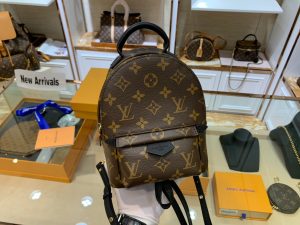 LOUIS VUITTON Palm Springs Mini Back Pack. Original Quality Bag including gift box, literature, dust bag, authenticity card. The Palm Springs Mini gives a fresh twist to the backpack, transforming a utilitarian staple into an on-point city bag. An essential accessory for sporty urban nomads, this charming model is crafted from Monogram canvas with soft leather trim and gold-tone hardware. The quilted, foam-backed straps can be positioned in multiple ways, for shoulder or cross-body wear.