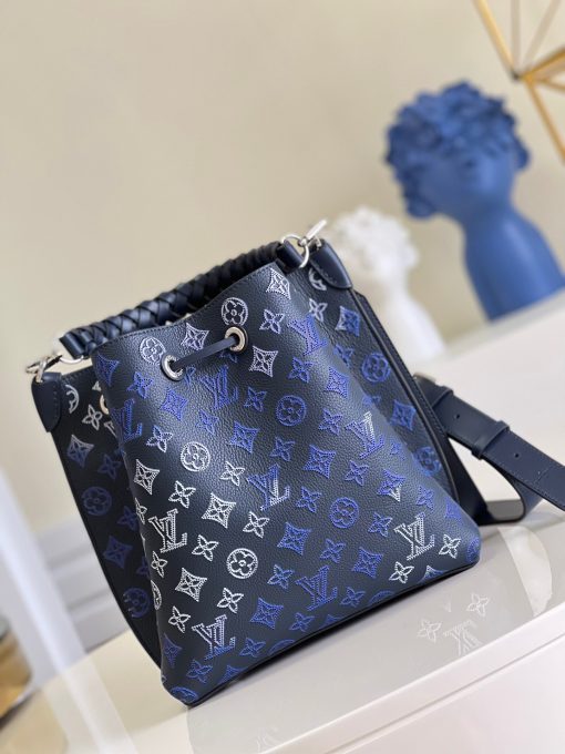 LOUIS VUITTON Muria. Authentic quality luxury bag crafted in genuine leather comes with authenticity card, dust bag and gift bag. A Fashionable Fusion of Colors and Craftsmanship! Introducing the Muria bucket bag, crafted from a refreshing Mahina perforated leather in a unique blend of blue, red, and caramel hues. Each tiny hole intricately hand-dyed, this striking tricolor rendition of the iconic Monogram pattern adds a vibrant flair to the supple calf leather. Completing the ensemble, the bag features a beautifully braided top handle.
