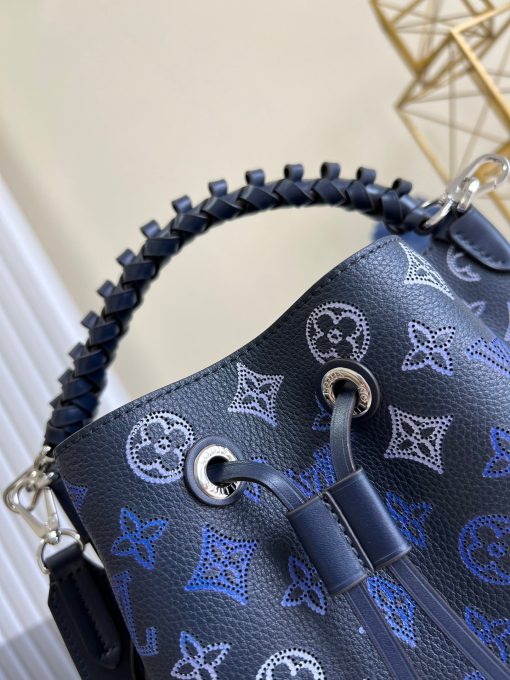 LOUIS VUITTON Muria. Authentic quality luxury bag crafted in genuine leather comes with authenticity card, dust bag and gift bag. A Fashionable Fusion of Colors and Craftsmanship! Introducing the Muria bucket bag, crafted from a refreshing Mahina perforated leather in a unique blend of blue, red, and caramel hues. Each tiny hole intricately hand-dyed, this striking tricolor rendition of the iconic Monogram pattern adds a vibrant flair to the supple calf leather. Completing the ensemble, the bag features a beautifully braided top handle.