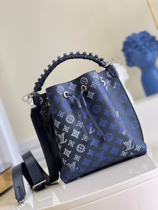 LOUIS VUITTON Muria. Authentic quality luxury bag crafted in genuine leather comes with authenticity card, dust bag and gift bag. A Fashionable Fusion of Colors and Craftsmanship! Introducing the Muria bucket bag, crafted from a refreshing Mahina perforated leather in a unique blend of blue, red, and caramel hues. Each tiny hole intricately hand-dyed, this striking tricolor rendition of the iconic Monogram pattern adds a vibrant flair to the supple calf leather. Completing the ensemble, the bag features a beautifully braided top handle.