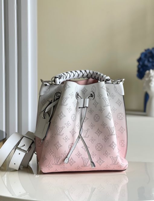 LOUIS VUITTON Muria. Authentic quality luxury bag crafted in genuine leather comes with authenticity card, dust bag and gift bag. A Fashionable Fusion of Colors and Craftsmanship! Introducing the Muria bucket bag, crafted from a refreshing Mahina perforated leather in a unique blend of blue, red, and caramel hues. Each tiny hole intricately hand-dyed, this striking tricolor rendition of the iconic Monogram pattern adds a vibrant flair to the supple calf leather. Completing the ensemble, the bag features a beautifully braided top handle.