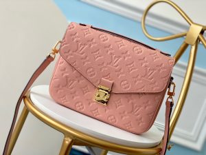 LOUIS VUITTON Pochette Métis Monogram Empreinte Leather. Authentic quality luxury bag crafted in genuine leather comes with authenticity card, dust bag and gift bag. Elegance meets functionality. The epitome of grace and sophistication is embodied in the dainty silhouette of the Pochette Métis. Crafted from supple Monogram empreinte leather, its petite proportions unveil a plethora of practical pockets and compartments. - KRIS + KIKO LOUIS VUITTON Pochette Métis Monogram Empreinte Leather. Original Quality Bag. Gold-metal toned Hardware. LOUIS VUITTON Sales Box and Dust Bag. Booklet, Authenticity Card, Payment Slip. Elegance is personified in the petite shape of the Pochette Métis. Made of supple Monogram empreinte leather, its compact dimensions open up to reveal many useful pockets and compartments.