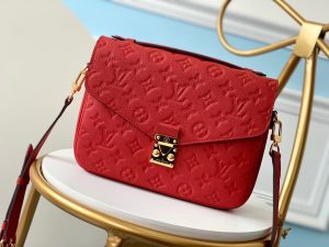 LOUIS VUITTON Pochette Métis Monogram Empreinte Leather. Authentic quality luxury bag crafted in genuine leather comes with authenticity card, dust bag and gift bag. Elegance meets functionality. The epitome of grace and sophistication is embodied in the dainty silhouette of the Pochette Métis. Crafted from supple Monogram empreinte leather, its petite proportions unveil a plethora of practical pockets and compartments. - KRIS + KIKO LOUIS VUITTON Pochette Métis Monogram Empreinte Leather. Original Quality Bag. Gold-metal toned Hardware. LOUIS VUITTON Sales Box and Dust Bag. Booklet, Authenticity Card, Payment Slip. Elegance is personified in the petite shape of the Pochette Métis. Made of supple Monogram empreinte leather, its compact dimensions open up to reveal many useful pockets and compartments.